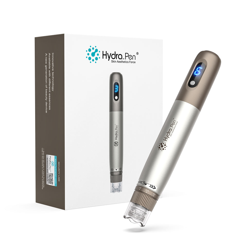 مقبض ⁦Hydra Pen H3⁩ باللونين الفضي والبرونزي بجوار علبته الأصلية